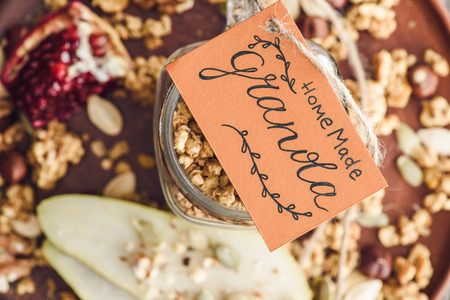 homemade granola in glass jar with tag