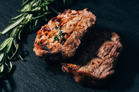 view of delicious juicy grilled meat with spicesの写真素材