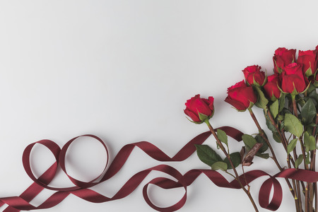 beautiful red roses with ribbon isolated on white, st valentines day conceptの写真素材