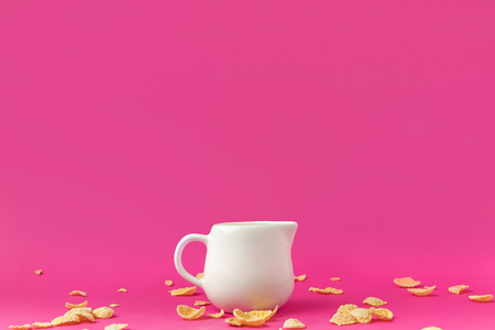 close-up view of jug with milk and crunchy corn flakes
