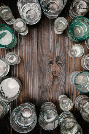 glasses with water on wooden tableの写真素材