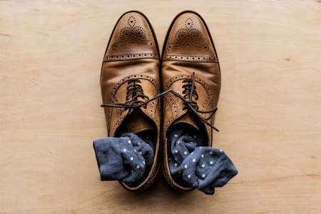 brown male shoes with socks insideの写真素材