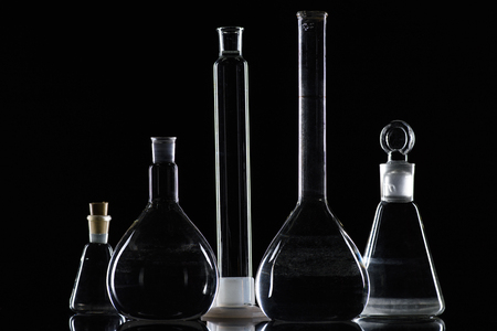 transparent glass flasks with substance in laboratoryの写真素材