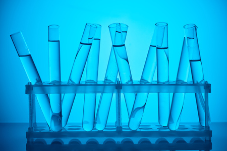 glass tubes with liquid on stand for scientific analysis