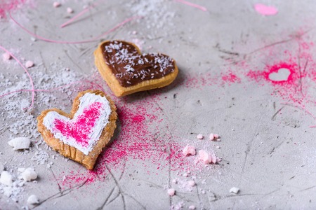 sweet tasty heart shaped cookies on grey surfaceの写真素材