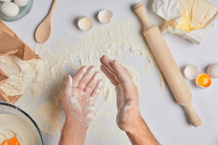 cropped image of chef applying flour on handsの写真素材