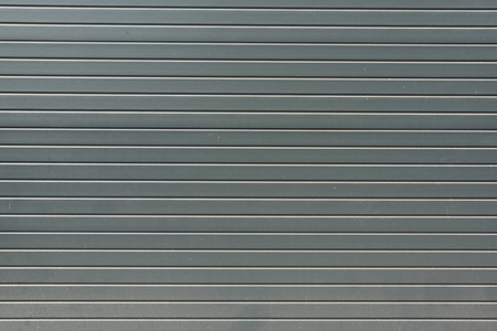 grey striped metal bling wall textured backgroundの写真素材