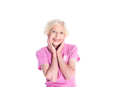senior woman in pink t-shirtの写真素材