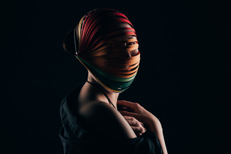 woman with colored quilling paper on head and naked shoulderの写真素材