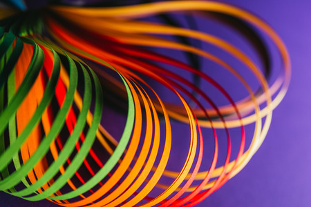 close up of colored quilling paper curves on purpleの写真素材