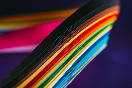 bright quilling paper curves on purpleの写真素材