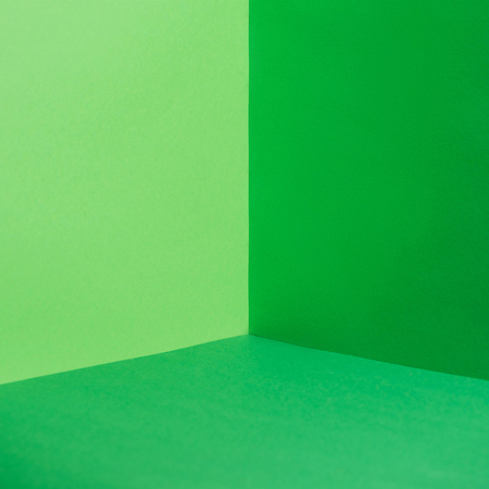 empty corner with green walls and floorの写真素材