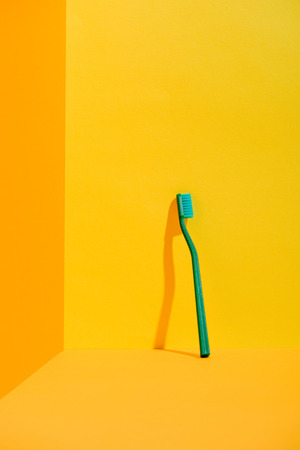 Green toothbrush standingの写真素材