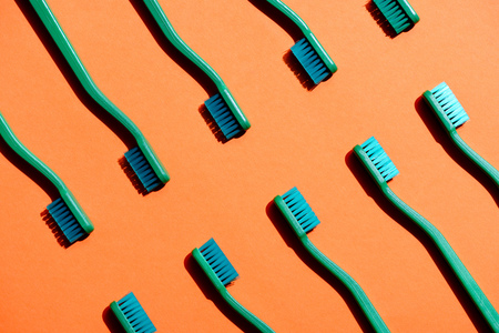 Minimalistic background with green toothbrushesの写真素材