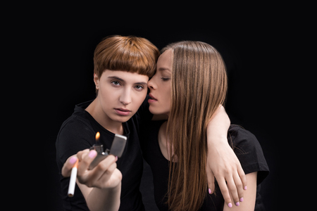 young woman hugging girlfriendの写真素材