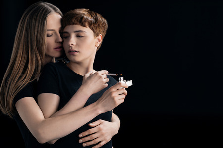 lesbian couple lighting cigaretteの写真素材