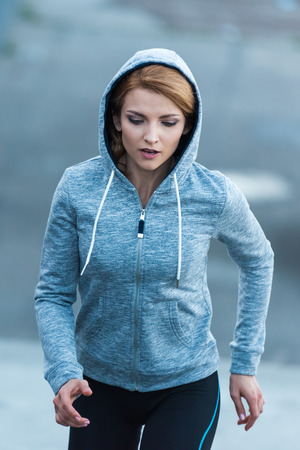 sportswoman running in cityの写真素材