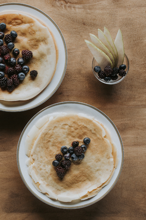 top view of delicious homemade pancakes with healthy berriesの写真素材