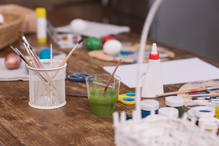 paint brushes and poster paints for easter eggsの写真素材