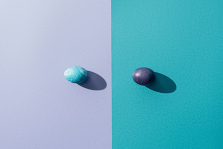 top view of traditional easter eggs, on blue and purpleの写真素材
