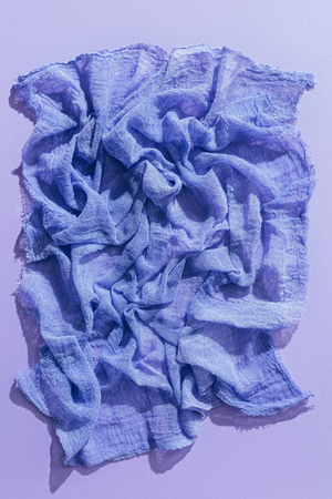 top view of purple gauze fabric on purple backgroundtissueの写真素材