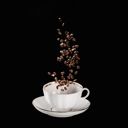 coffee beans falling into cup isolated on blackの写真素材