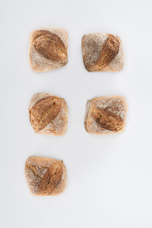 top view of healthy homemade bread loaves isolated on greyの写真素材
