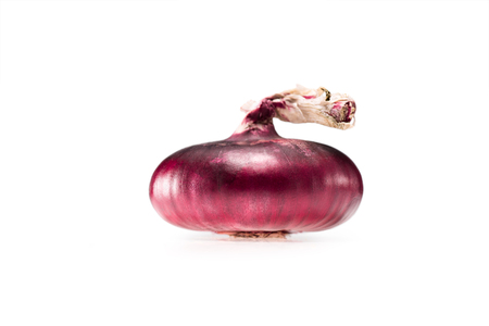 fresh ripe red unpeeled onion isolated on whiteの写真素材