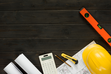 flat lay with arranged architectural working equipment on wooden tabletopの写真素材