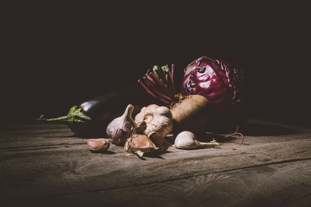 close-up view or ripe autumn vegetables on wooden tableの写真素材