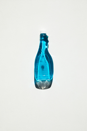 top view of plastic bottle with blue cleaning product isolated on white  の写真素材