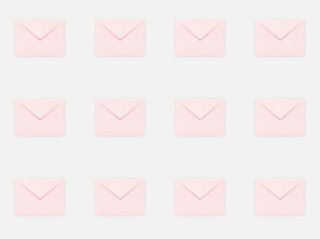 repetitive pattern of pink mail envelopesの写真素材