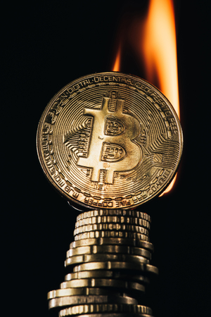 close up view of pile of bit coins with fireの写真素材