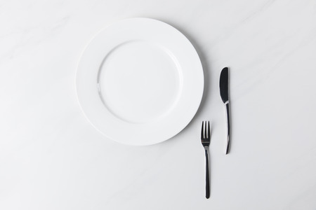 Top view of plate with fork and knifeの写真素材