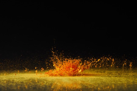 yellow holi powder explosion on black, Hindu spring festivalの写真素材