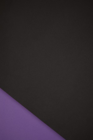 abstract background made from black and purple colored paperの写真素材