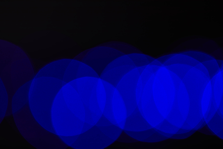 blue blurred circles on darkの写真素材
