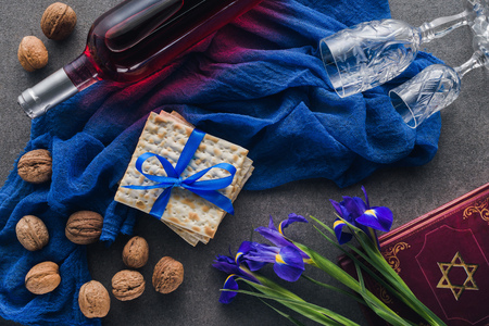 top view of matza, torah and wine on table, jewish Passover holiday concept