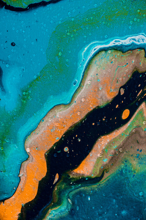 abstract background with blue and orange oil paint の写真素材