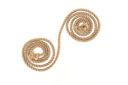 top view of arranged brown marine rope with knots isolated on whiteの写真素材