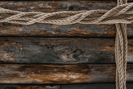 flat lay with arranged marine ropes on grunge wooden tabletopの写真素材