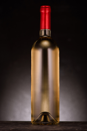 single bottle of luxury white wine on blackの写真素材