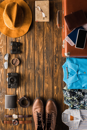 frame made of vintage suitcase with baggage for travel on wooden surfaceの写真素材