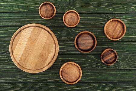 top view of different types of wooden round cutting boards on table の写真素材