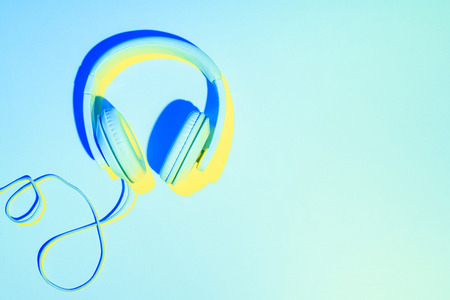 blue toned picture of headphones on blue background 