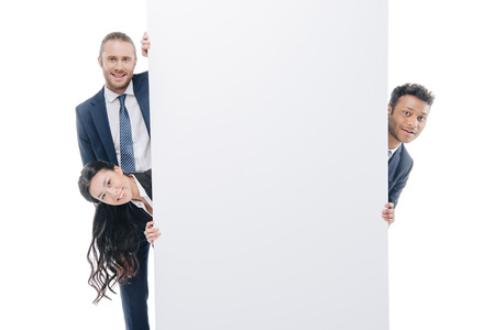 multiethnic businesspeople in formal wear with empty board, isolated on white の写真素材