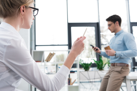 businesswoman and businessman working together in modern officeの写真素材
