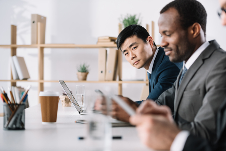 group of businessmen working together in modern officeの写真素材