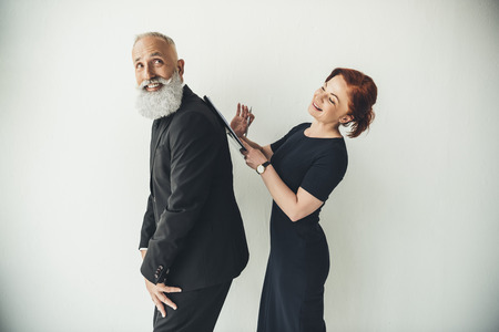 playful mature business people signing business contractの写真素材