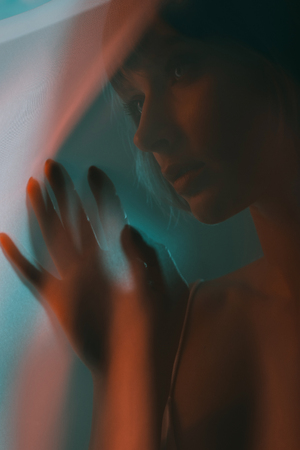 attractive sensual woman posing behind the veil